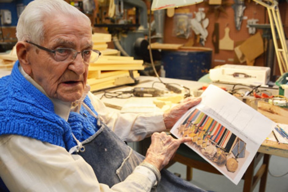 Robert Kennedy shows his medals