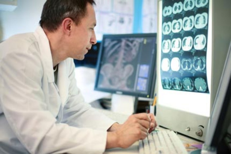 radiologist reviewing images on computer