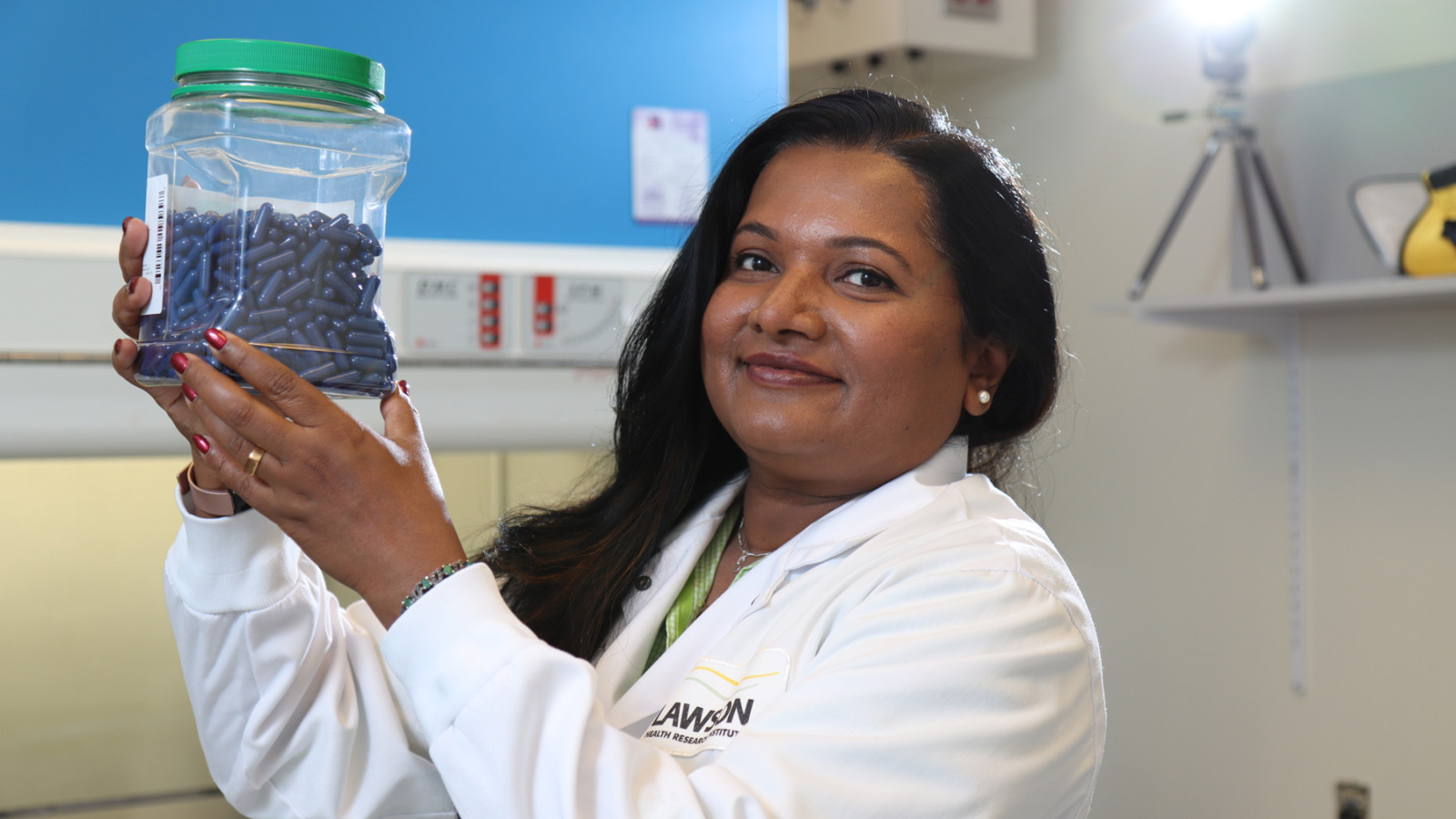 Seema Nair Parvathy (PhD), Research Coordinator with Lawson Health Research Institute, holds up fecal transplant capsules being used at St. Joseph’s Health Care London to treat patients with C. difficile and to study their potential use for many other health conditions.