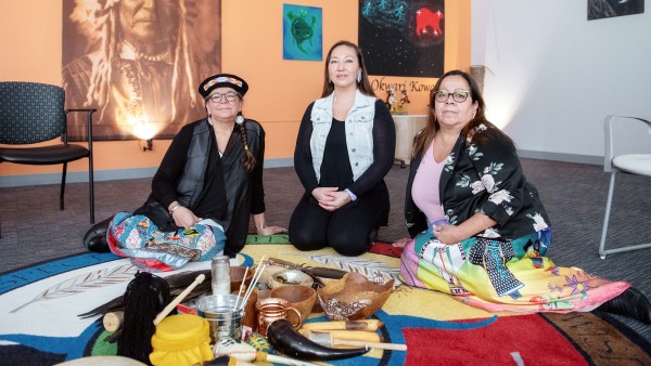 Indigenous women sitting down together