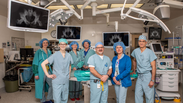 care providers wearing scrubs in the operating room