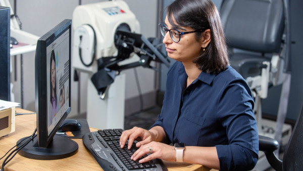 Dr. Swati Mehta typing on a keyboard