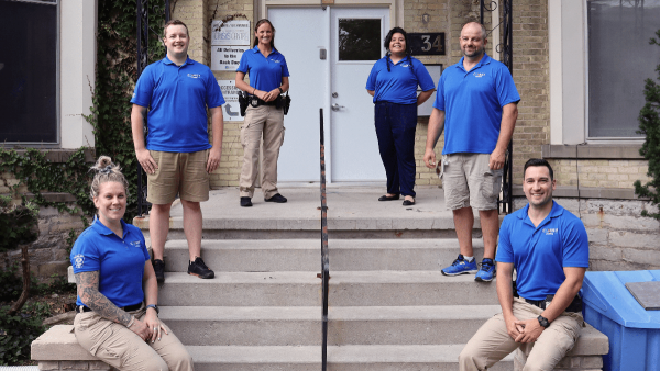 COAST team members standing on steps