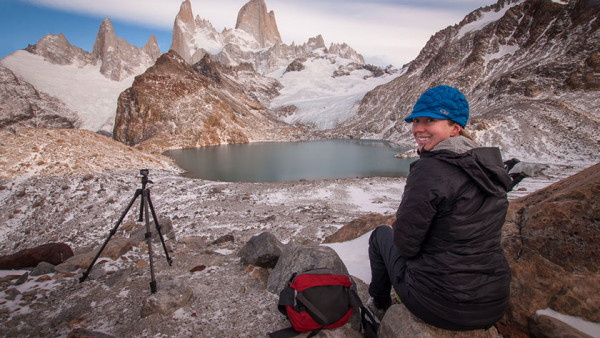 Jessica Kocur sitting on the rocky ground in a mountainous region of Argentina