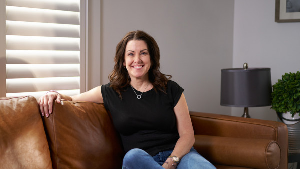 Krista Wilde sitting on a couch