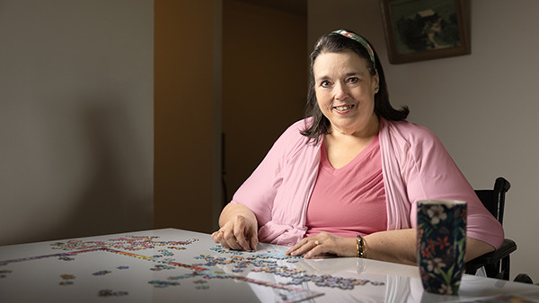 Doris sited assembling a puzzle