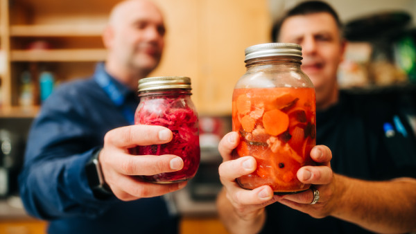 chefs with fermented food jars