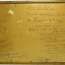 hand printed notations on the back of a framed print about a young patient's experience when severely ill