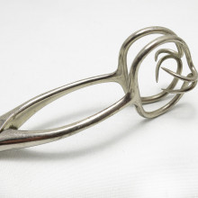 a stainless steel pair on vintage forceps with pointed hooks