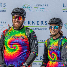 two people in cycling uniforms