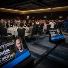 event attendees sitting down at their tables and eating breakfast