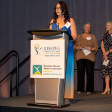 Mary St. Onge giving acceptance speech at podium