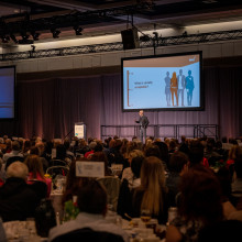 Stéphane Grenier giving keynote address on stage