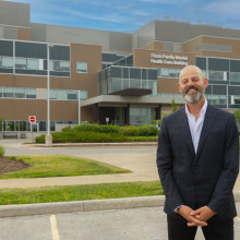 Ryan Finch in front of mental health care building