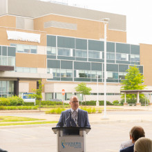 Roy Butler, President and CEO, at podium.