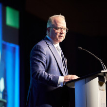 Roy Butler at podium on stage