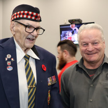 Corporal George Herbert Beardshaw standing next to Dale Hunter, London Knights' coach