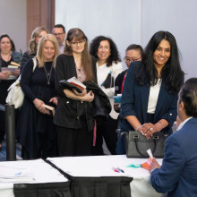 Attendees line up to purchase books autographed by Neil Pasricha