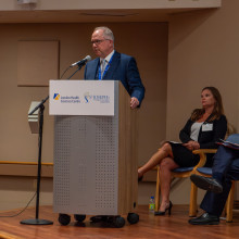 Roy speaking at research launch
