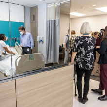 nurse and guests reflected in mirror