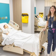 nurse poses with mannequin