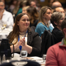 Woman in crowd smiling