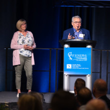 Man and woman accepting award