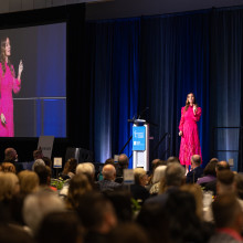 Woman speaking to crowd