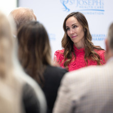 Woman smiling at crowd