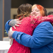 Two women hugging