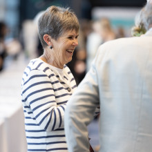 Woman in striped sweater smiling