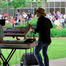 Band rocking out in front of a crowd