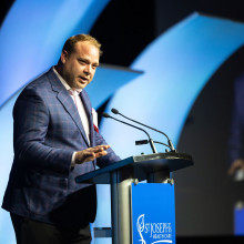 Adam Tyman of Clintar speaks at the Tribute Dinner