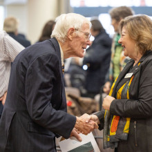 A Veteran and Michelle Campbell greet each other warmly