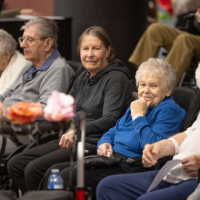 The Veterans choir sit with smiles and anticipation