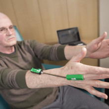 Research patient wearing TremorTek