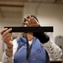 Close up of hands constructing an item