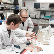 Two young scientists studying microbiome and probiotics