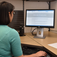 Dr. Mehta at computer